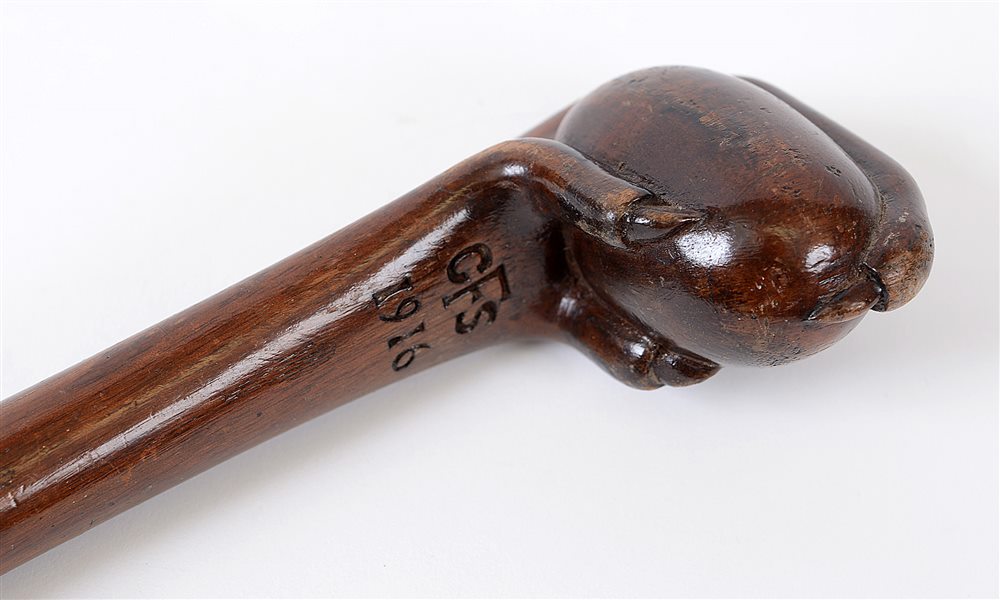 GREAT WAR - A MAHOGANY CARVED WALKING CANE with egg and claw stylized grip, tapered shaft