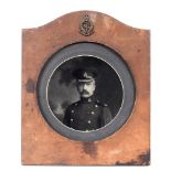 GREAT WAR - ROYAL ARMY MEDICAL CORPS A Leather Photograph Frame containing a circular black and