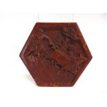 SECOND WORLD WAR - A RARE U.S. GERMAN PRISONER OF WAR CARVED PINE HEXAGONAL PANEL decorated in the