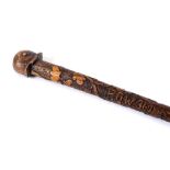 GREAT WAR - AN IMPERIAL GERMAN 'PRISONER OF WAR' CARVED WOODEN WALKING CANE decorated with oak leafs