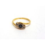 A THREE STONE SAPPHIRE AND DIAMOND RING stamped '18ct & Plat', finger size O1/2, 2.5g gross