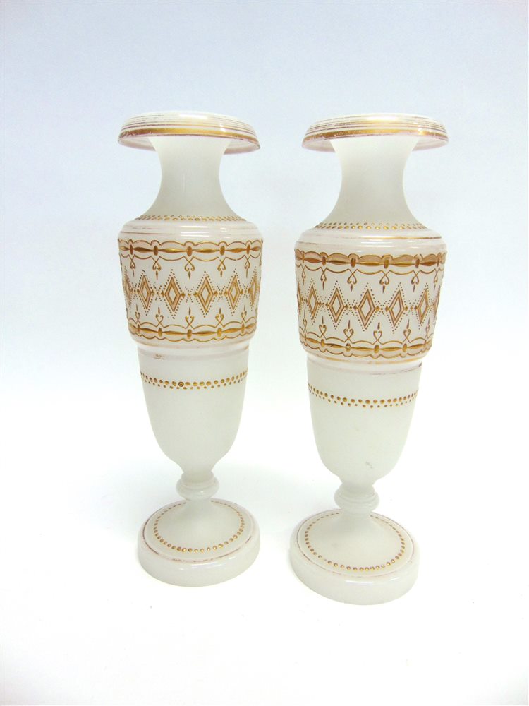 A PAIR OF OPAQUE GLASS VASES with gilt jewelled decoration, 35.5cm high