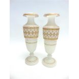 A PAIR OF OPAQUE GLASS VASES with gilt jewelled decoration, 35.5cm high