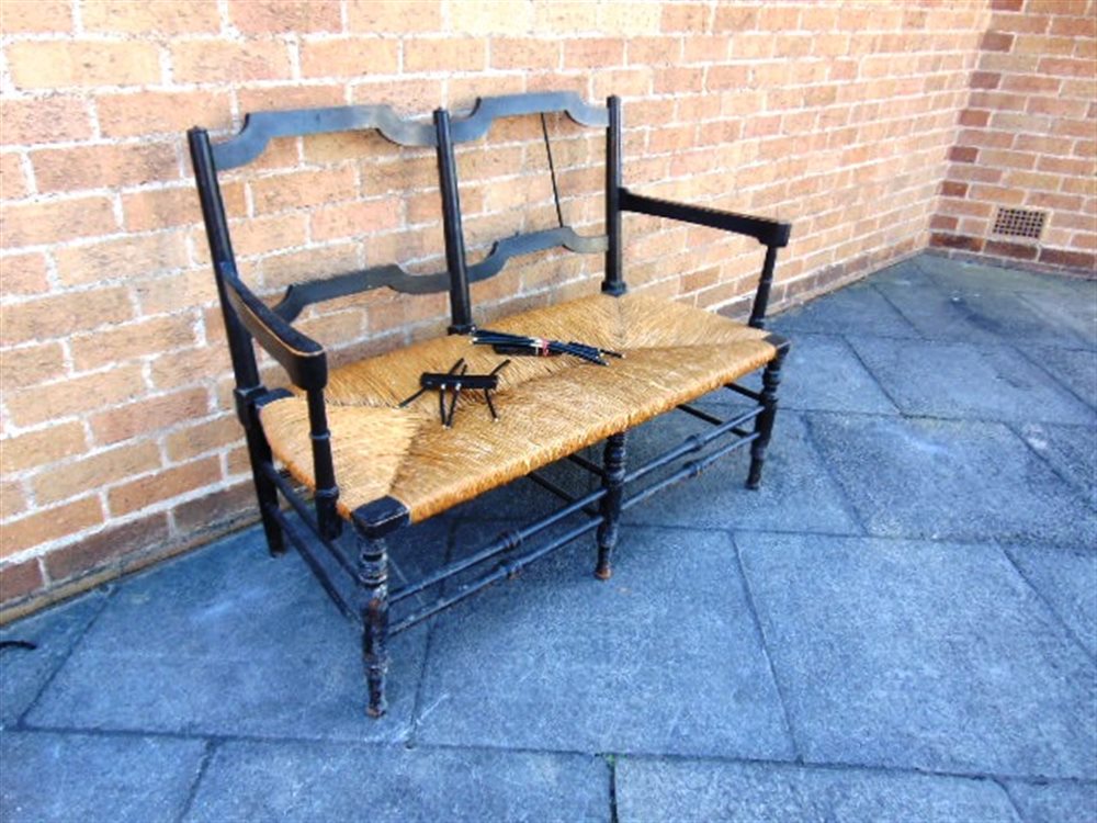A WILLIAM MORRIS 'ROSETTI' RUSH SEAT SOFA, with ebonised beech frame on turned stretcher base, 119cm - Image 2 of 5