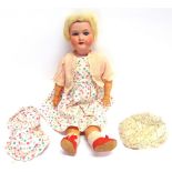 AN ARMAND MARSEILLE BISQUE SOCKET HEAD DOLL with a cropped blonde wig, sleeping blue glass eyes, and