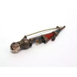 A SCOTTISH PEBBLE BROOCH in the form of a Dirk, set with agates and smokey quartz, 9.5cm long