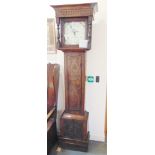 A 30-HOUR LONGCASE CLOCK in carved oak case, the enamel dial with painted decoration and calendar