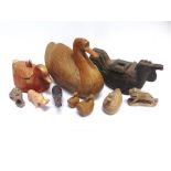 A COLLECTION OF CARVED WOODEN AND STONE FIGURES OF ANIMALS, the largest wooden duck with hidden