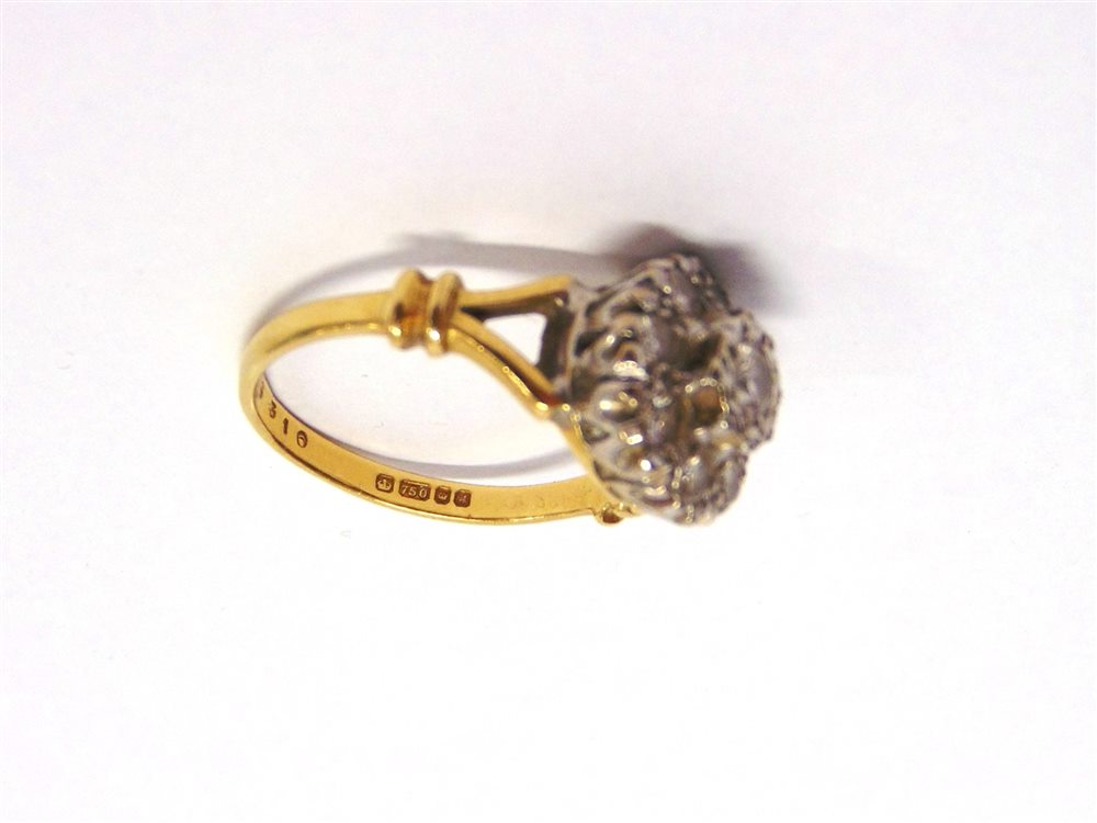 A NINE STONE DIAMOND 18 CARAT GOLD CLUSTER RING the illusion set brilliant cuts totalling - Image 2 of 4