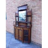 AN EDWARDIAN INLAID WALNUT SIDE CABINET the backrest with inset rectangular bevelled mirror, flanked