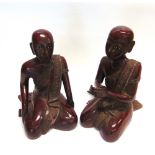 A LARGE PAIR OF CARVED AND LACQUERED WOODEN FIGURES, both kneeling in prayer, 45cm high
