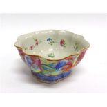 A CHINESE PEDESTAL BOWL OF SHAPED OUTLINE the interior decorated with flowers in the Famille Rose