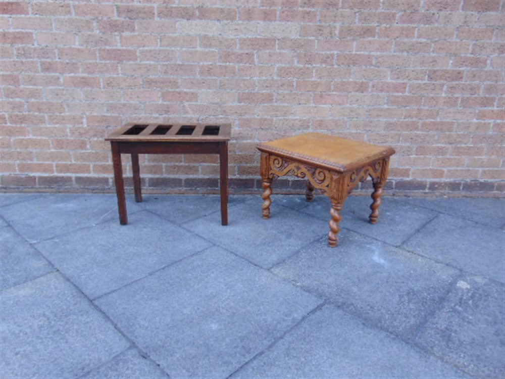 AN OAK LUGGAGE STAND, 61cm wide 41cm deep 49cm high; and a carved oak occasional table, 54cm
