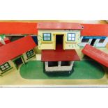 A BINBAK TOY RIDING STABLES of painted wooden construction; together with a quantity of toy farm