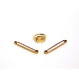 A 9 CARAT GOLD SIGNET RING a pair of pins, stamped '9ct'; 8.4g gross