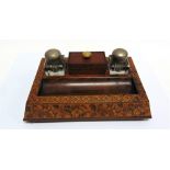 TREEN: A TUNBRIDGE WARE DESK STAND with twin glass inkwells and pen tray, on compressed bun feet,
