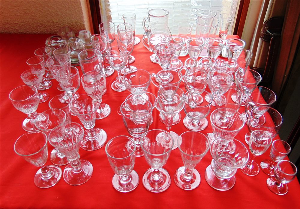 A MIXED COLLECTION OF GLASSWARE including custard cups, penny licks, eye glasses, measuring beakers,