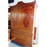 A 19TH CENTURY MAHOGANY LINEN PRESS fitted with two short and two long drawers on splayed bracket