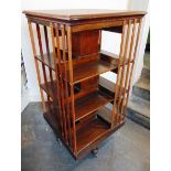 A LARGE EDWARDIAN OAK REVOLVING BOOKSTAND, 60cm square 119cm high