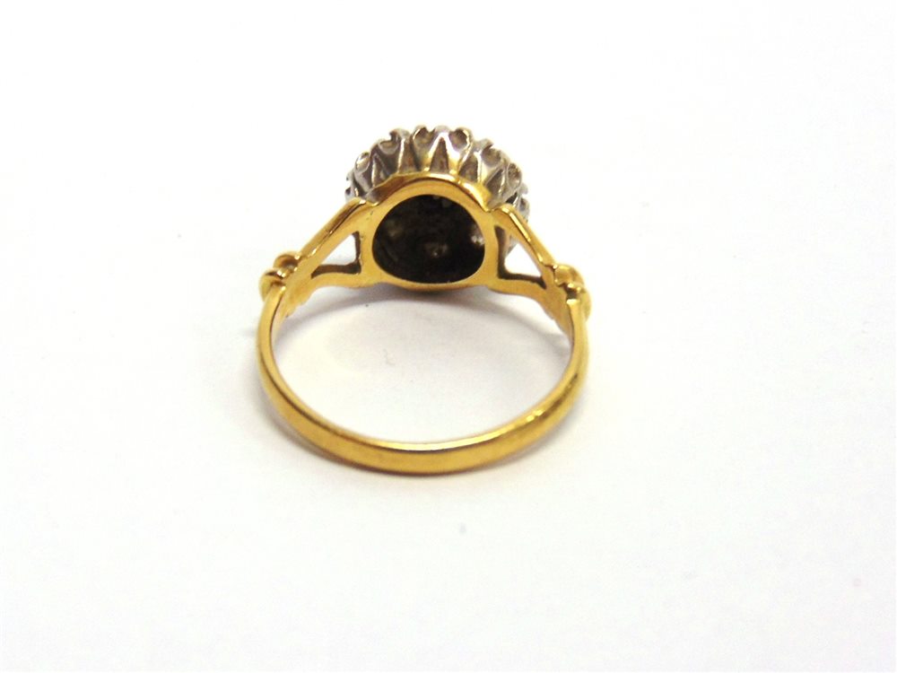 A NINE STONE DIAMOND 18 CARAT GOLD CLUSTER RING the illusion set brilliant cuts totalling - Image 4 of 4