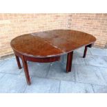 A 19TH CENTURY MAHOGANY DINING TABLE on square chamfered supports, the two D-end tables 138cm wide