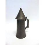 A PEWTER LIDDED TANKARD, the hinged cover of conical form, 27.5cm high