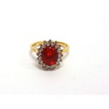 A FIRE OPAL AND DIAMOND 18 CARAT GOLD CLUSTER RING the oval shallow cabochon with facetted base