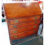 A 19TH CENTURY MAHOGANY BUREAU the fitted interior over four long drawers with brass campaign