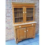 A STRIPPED PINE DRESSER, the upper section with twin glazed doors, the base with single drawer