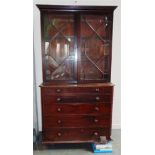 A 19TH CENTURY SECRETAIRE BOOKCASE the associated astragal glazed bookcase top with dentil frieze,