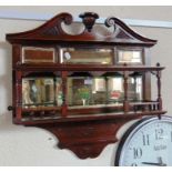 A CARVED WALNUT MIRRORED HANGING SHELF BRACKET 74cm wide 72cm high