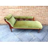 A VICTORIAN CARVED WALNUT FRAMED CHAISE LONGUE, on turned supports, 167cm long 63cm deep 80cm high