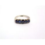 A FIVE STONE SAPPHIRE RING the white mount stamped '18ct' finger size P, 3.8g gross