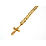 A CHAIN, STAMPED '14KT' of filed curb links, 50cm long; with a crucifix attached stamped '585',