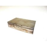 A SILVER CIGARETTE BOX wooden lines, engine turned cover, presentation inscription, 16.5cm long