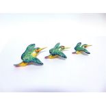 A GRADUATED SET OF THREE BESWICK FLYING KINGFISHERS, printed and impressed marks to reverse, the