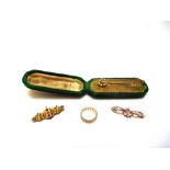 A 9 CARAT GOLD ETERNITY STYLE RING 3.4g gross; a 9 carat gold late Victorian locket brooch; a