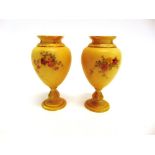 A PAIR OF ROYAL WORCESTER BLUSH IVORY PEDESTAL VASES shape 2260, painted floral decoration