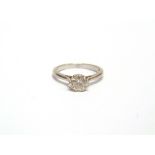 A DIAMOND SINGLE STONE RING stamped 'Plat', the brilliant cut calculated as weighing approximately