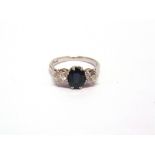 A SAPPHIRE AND DIAMOND THREE STONE RING stamped 'Plat', the oval cut, measuring approximately 7.