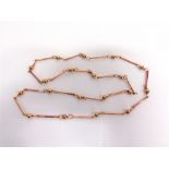 ROMA GALTON: A 9 CARAT ROSE GOLD CHAIN London 1990, of bead and baton links, 82cm long, 26.7g gross