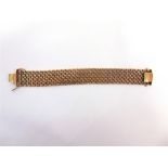 A 9 CARAT GOLD BRACELET OF FILED MESH LINKS to a hidden box clasp with two safety catches, 2.1cm