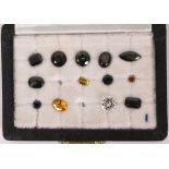 A CASED SET OF THIRTEEN LOOSE GEMSTONES listed and stated as the following, row 1 (left to right)