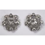 A PAIR OF DIAMOND CLUSTER EARSTUDS the central stone of approximately 0.5 carats enclosed by a