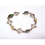 AN ART NOUVEAU TURQUOISE & FRESHWATER PEARL BRACELET with arrow head like motifs in between, stamped