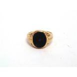 A 9 CARAT GOLD BLOODSTONE SET SIGNET RING London 1959, finger size L, 4.9g gross