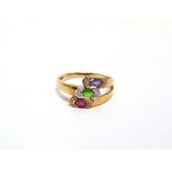 A 9 CARAT GOLD TRIPLE GEM AND DIAMOND RING set with tanzanite, green tourmaline, rubelite and single