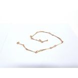 ROMA GALTON: A 9 CARAT ROSE GOLD CHAIN London 1985, of baton and figure of eight links, 42cm long,