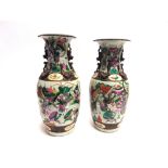 A PAIR OF CHINESE VASES OF BALUSTER FORM WITH FLARED RIM decorated with a procession of figures on
