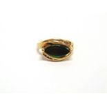 AN AMMOLITE COMPOSITE STONE AND DIAMOND 9 CARAT GOLD RING the eye shaped stone between channel set